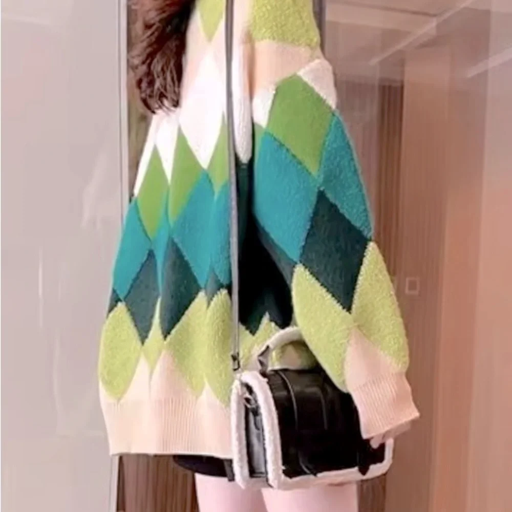 Green and cream harlequin patterned button up sweater